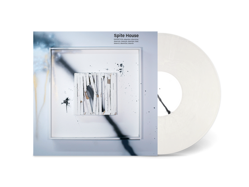 A white vinyl record partially slides from its abstract cover—splattered with paint and a square design in black, white, and muted brown. The post-hardcore concept album Desertion by DOUSE appears here on New Morality Zine.